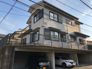 A two story building with parking underneath