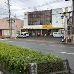 View of across the street from the bus stop is a post office