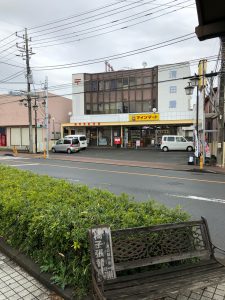 View of across the street from the bus stop is a post office